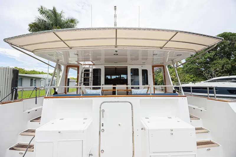 Slide: The Image of Grand Banks 72 Aleutian RP 2005 yacht stern view with spacious deck and canopy. - 8