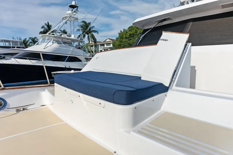 Slide: The Image of 2005 Grand Banks 72 Aleutian RP yacht with blue cushioned seating on deck. - 121