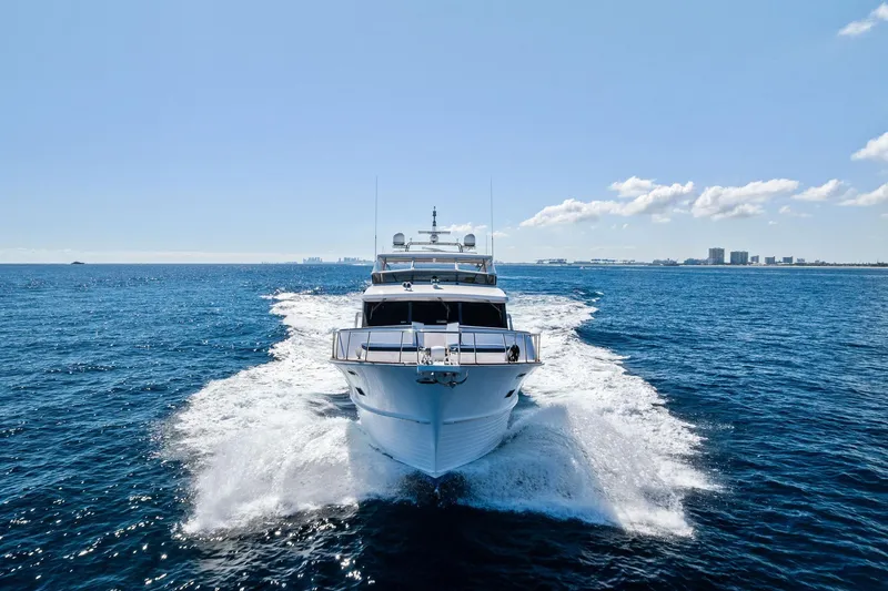 Slide: The Image of 2005 Grand Banks 72 Aleutian RP yacht cruising on open sea under clear sky. - 194