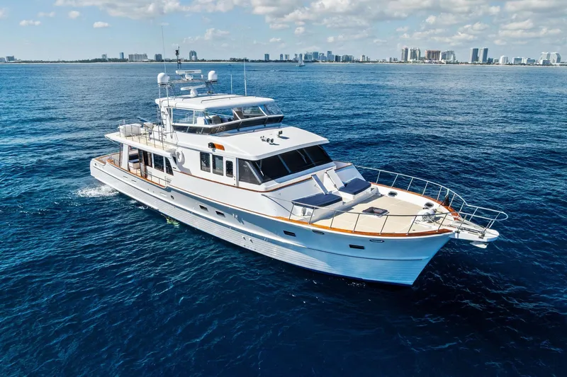 Slide: The Image of Luxury 2005 Grand Banks 72 Aleutian RP yacht cruising on open sea. - 186