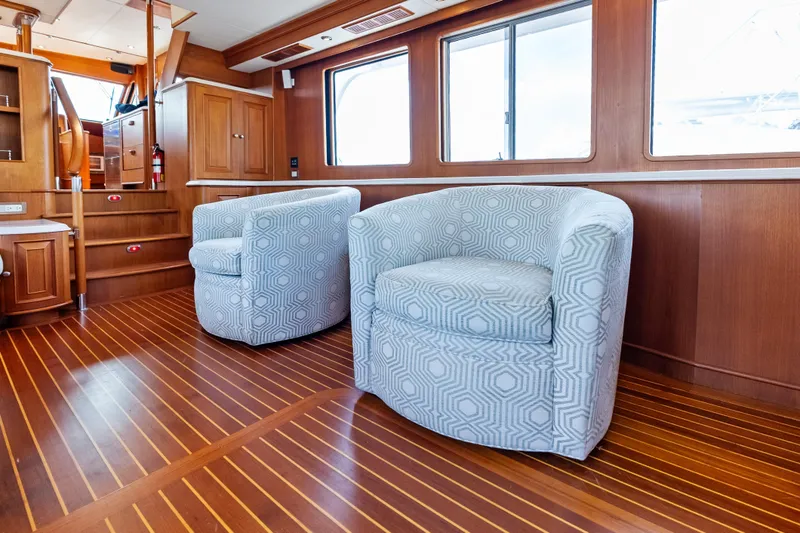 Slide: The Image of Luxurious interior of 2005 Grand Banks 72 Aleutian RP yacht with elegant seating and wood finish. - 69