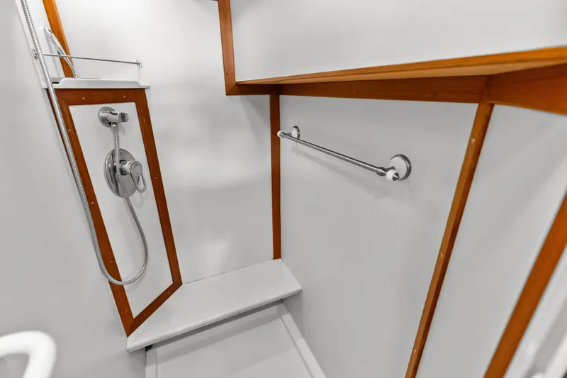 Slide: The Image of Shower area in 2005 Grand Banks 72 Aleutian RP yacht with wooden accents. - 114