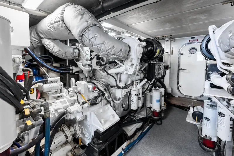 Slide: The Image of Engine room of 2005 Grand Banks 72 Aleutian RP yacht, showcasing machinery and equipment. - 147