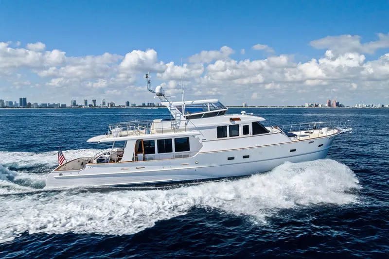 Slide: The Image of 2005 Grand Banks 72 Aleutian RP yacht cruising on open water under a clear sky. - 188
