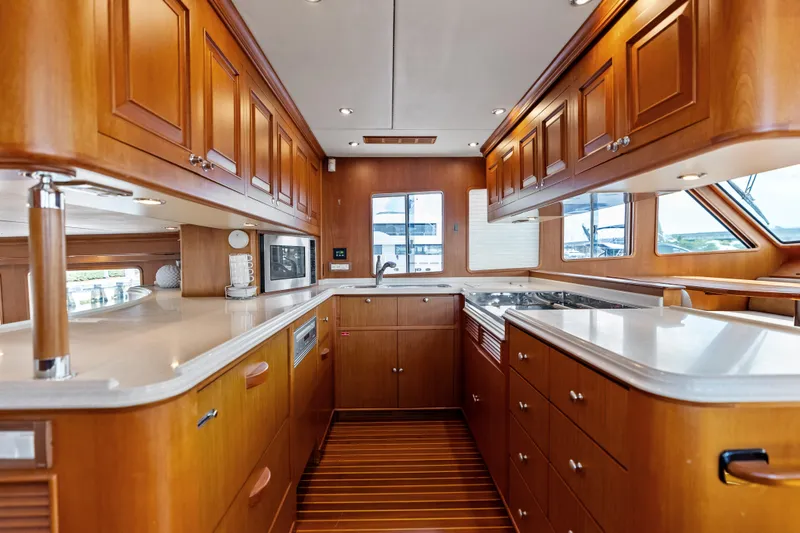 Slide: The Image of Luxurious wooden kitchen interior of 2005 Grand Banks 72 Aleutian RP yacht. - 74