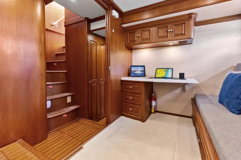 Slide: The Image of Luxurious interior of 2005 Grand Banks 72 Aleutian RP yacht with wooden cabinetry and workspace. - 93