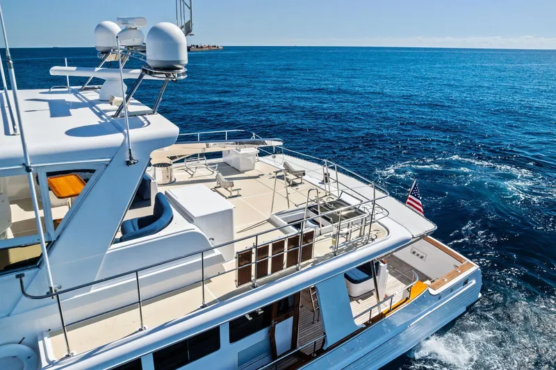 Slide: The Image of Luxurious 2005 Grand Banks 72 Aleutian RP yacht cruising on open sea. - 36