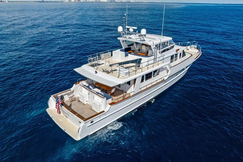 Slide: The Image of 2005 Grand Banks 72 Aleutian RP yacht cruising on open blue sea. - 34