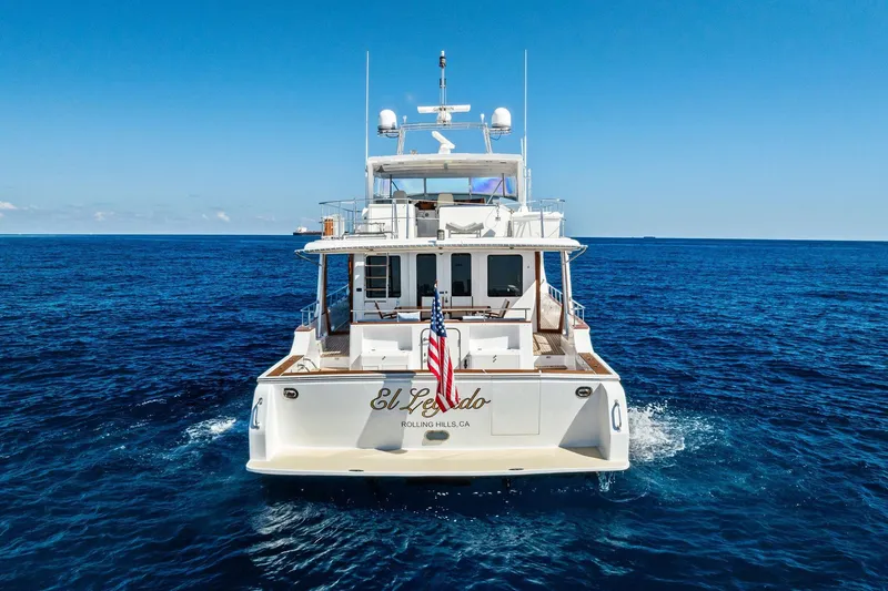 Slide: The Image of Grand Banks 72 Aleutian RP yacht cruising on open sea, rear view, 2005 model. - 200