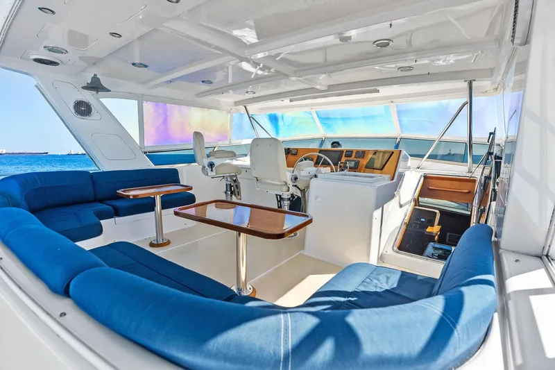 Slide: The Image of Luxurious 2005 Grand Banks 72 Aleutian RP yacht interior with blue seating and helm. - 157