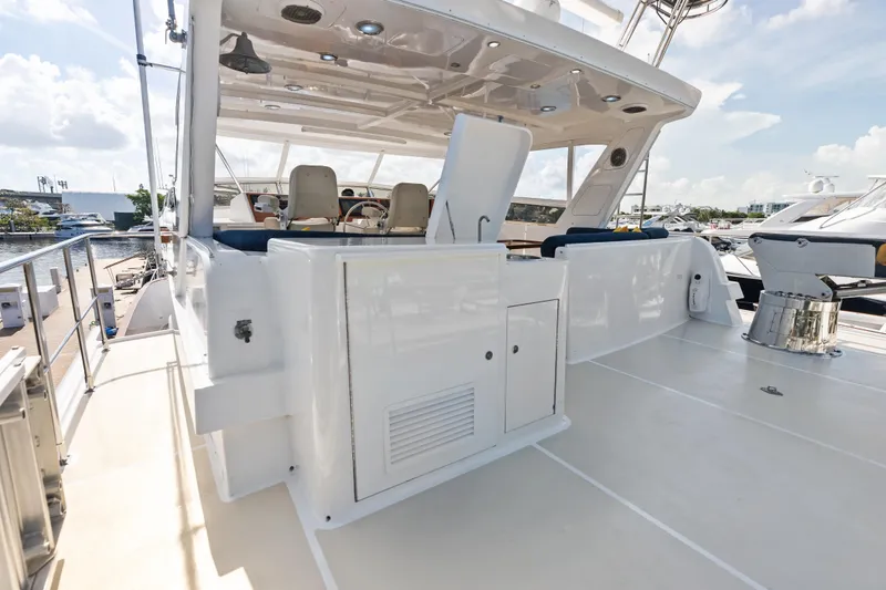 Slide: The Image of 2005 Grand Banks 72 Aleutian RP yacht deck with seating and helm station. - 133