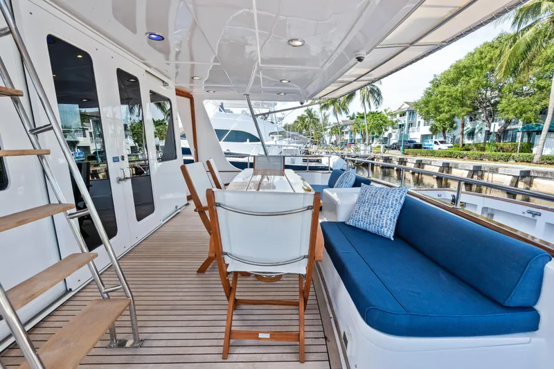 Slide: The Image of Luxurious 2005 Grand Banks 72 Aleutian RP yacht deck with seating and dining area. - 53