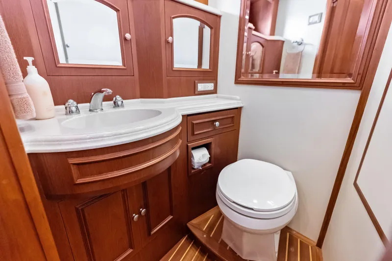 Slide: The Image of Luxurious 2005 Grand Banks 72 Aleutian RP yacht bathroom with wooden cabinetry and modern fixtures. - 111