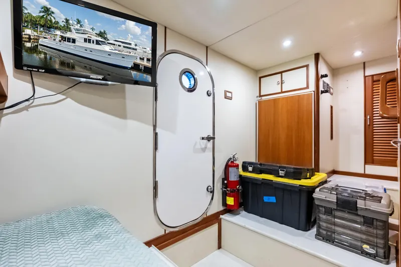 Slide: The Image of Interior of 2005 Grand Banks 72 Aleutian RP yacht with storage boxes and TV. - 151