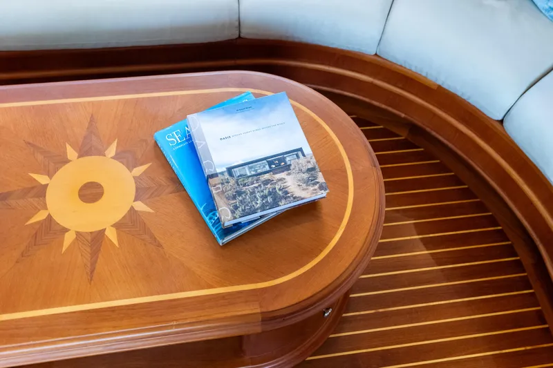 Slide: The Image of Luxurious Grand Banks 72 Aleutian RP 2005 yacht interior with elegant wooden table and magazines. - 70