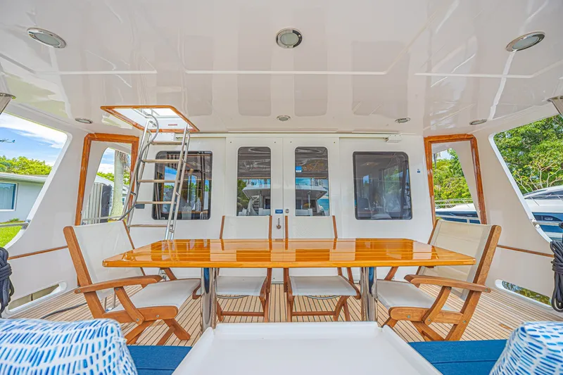 Slide: The Image of Luxurious 2005 Grand Banks 72 Aleutian RP yacht deck with elegant seating and table. - 10