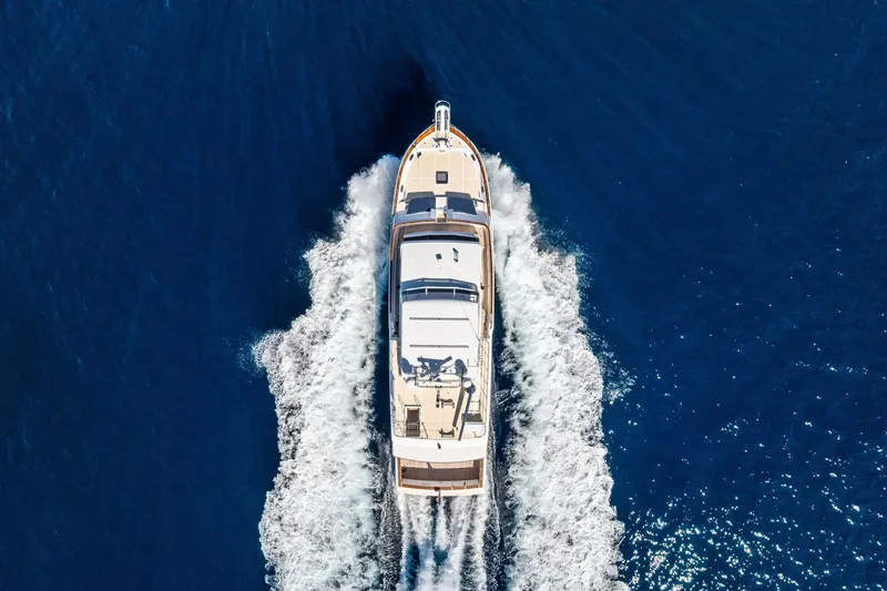 Slide: The Image of Aerial view of 2005 Grand Banks 72 Aleutian RP yacht cruising on open sea. - 35