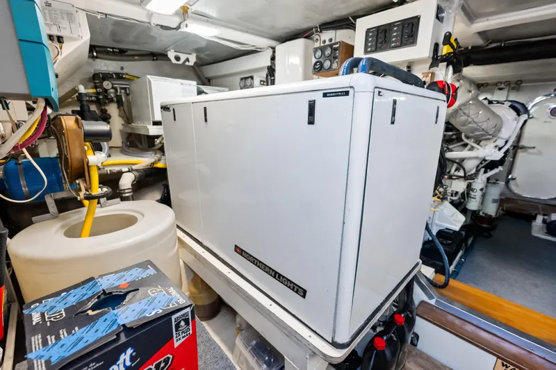 Slide: The Image of Engine room of 2005 Grand Banks 72 Aleutian RP yacht with generator and equipment. - 145