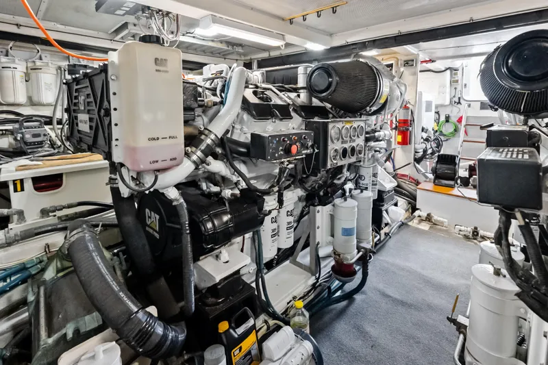 Slide: The Image of Engine room of 2005 Grand Banks 72 Aleutian RP yacht, featuring CAT machinery and equipment. - 146