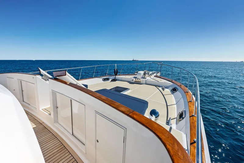 Slide: The Image of 2005 Grand Banks 72 Aleutian RP yacht cruising on open sea under clear blue sky. - 168