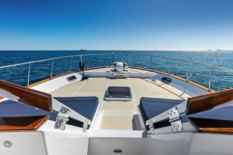 Slide: The Image of 2005 Grand Banks 72 Aleutian RP yacht deck with ocean view and clear blue sky. - 172