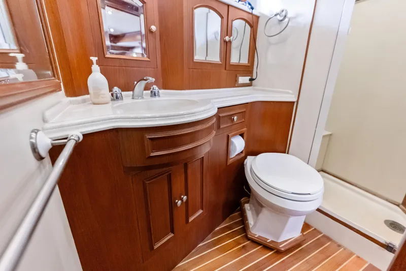 Slide: The Image of Luxurious 2005 Grand Banks 72 Aleutian RP yacht bathroom with wood accents and modern fixtures. - 106