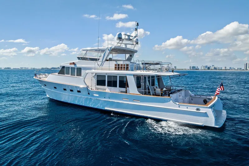 Slide: The Image of 2005 Grand Banks 72 Aleutian RP yacht cruising on open water under clear skies. - 184