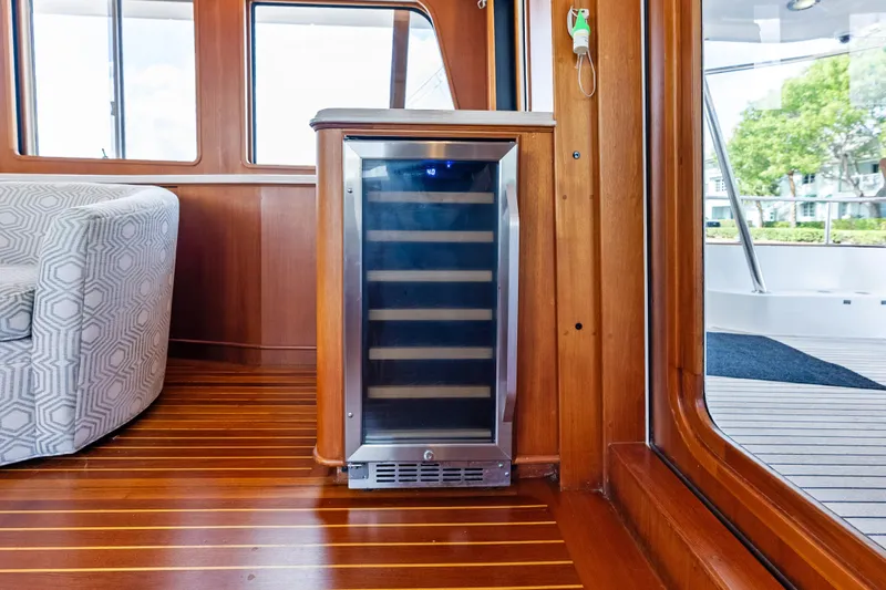 Slide: The Image of Luxurious interior of 2005 Grand Banks 72 Aleutian RP yacht with wine cooler. - 62