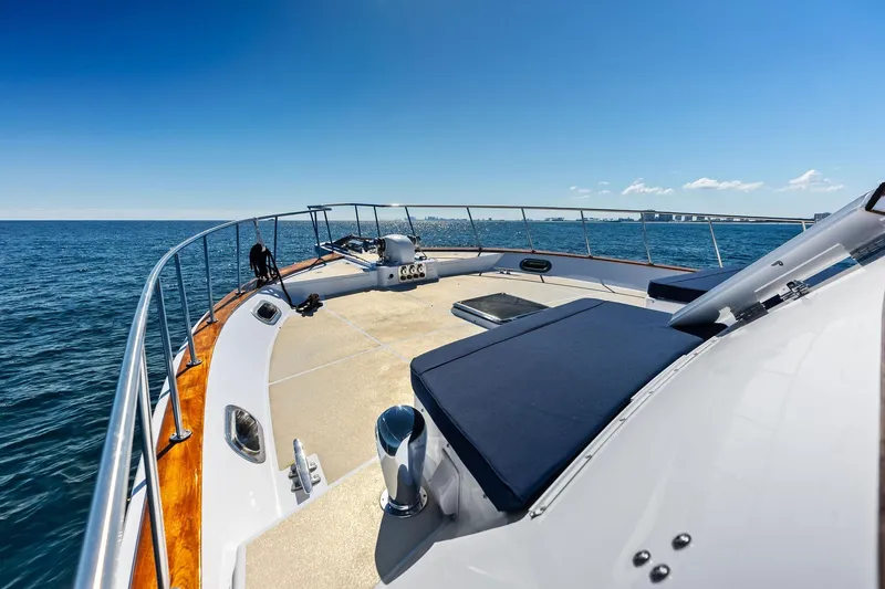 Slide: The Image of 2005 Grand Banks 72 Aleutian RP yacht deck with ocean view under clear blue sky. - 174