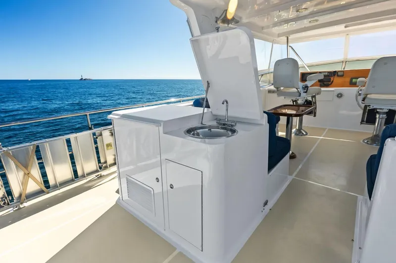 Slide: The Image of 2005 Grand Banks 72 Aleutian RP yacht interior with sink and seating, ocean view. - 165