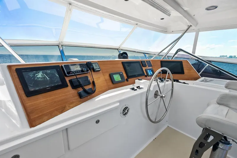 Slide: The Image of Helm of 2005 Grand Banks 72 Aleutian RP yacht with navigation equipment and steering wheel. - 160