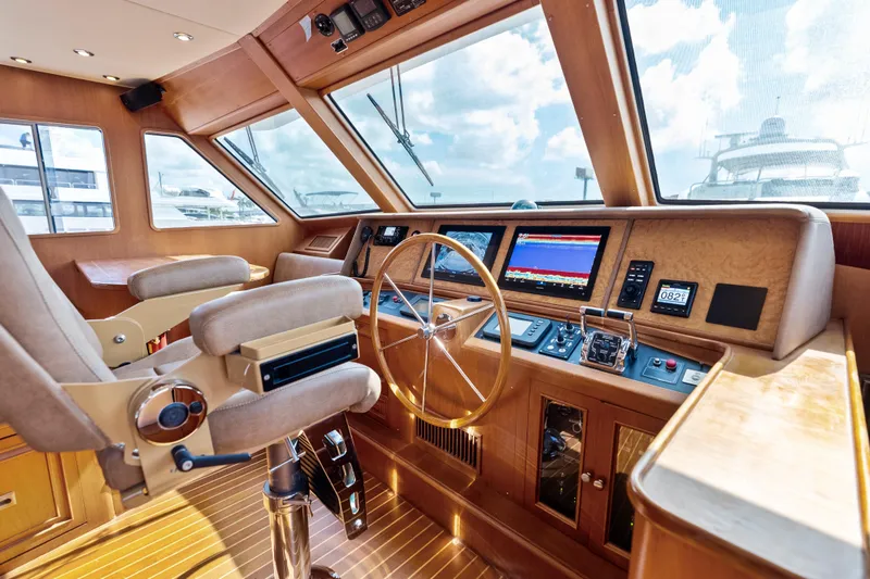 Slide: The Image of Luxurious helm of 2005 Grand Banks 72 Aleutian RP yacht with modern navigation equipment. - 84