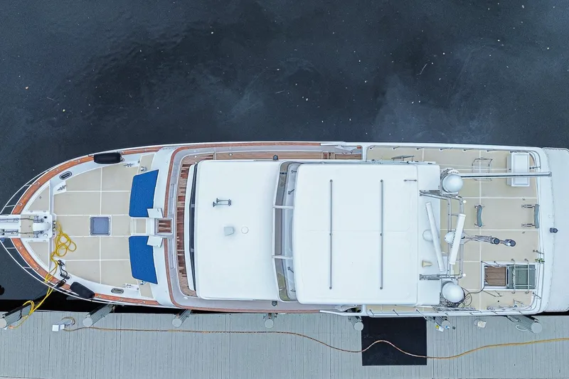 Slide: The Image of Aerial view of 2005 Grand Banks 72 Aleutian RP yacht docked at a marina. - 29