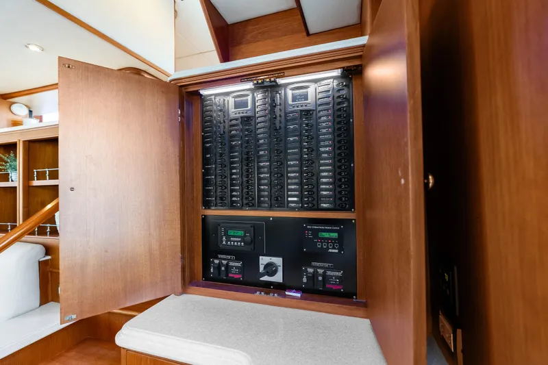 Slide: The Image of Electrical panel inside 2005 Grand Banks 72 Aleutian RP yacht, showcasing control systems. - 66