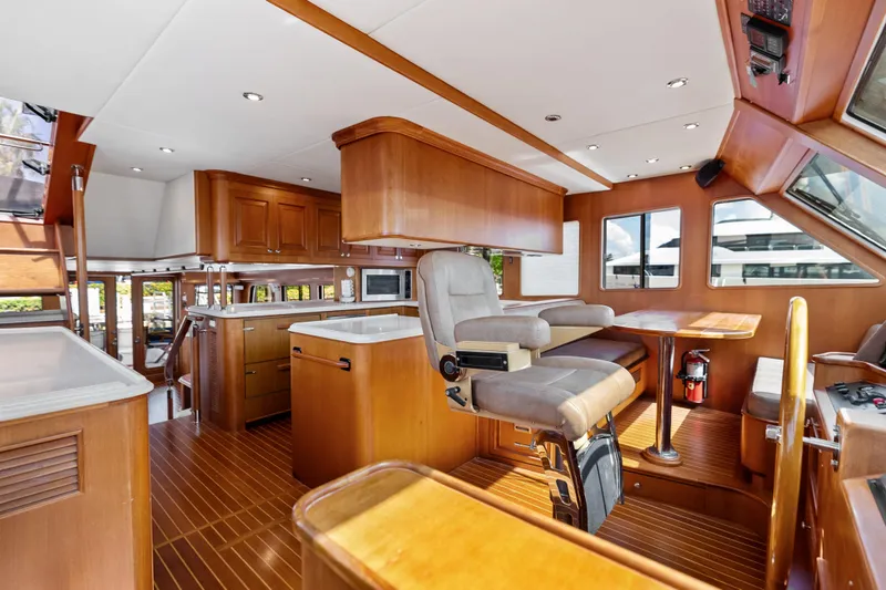 Slide: The Image of Luxurious interior of 2005 Grand Banks 72 Aleutian RP yacht with wood finishes and helm station. - 82