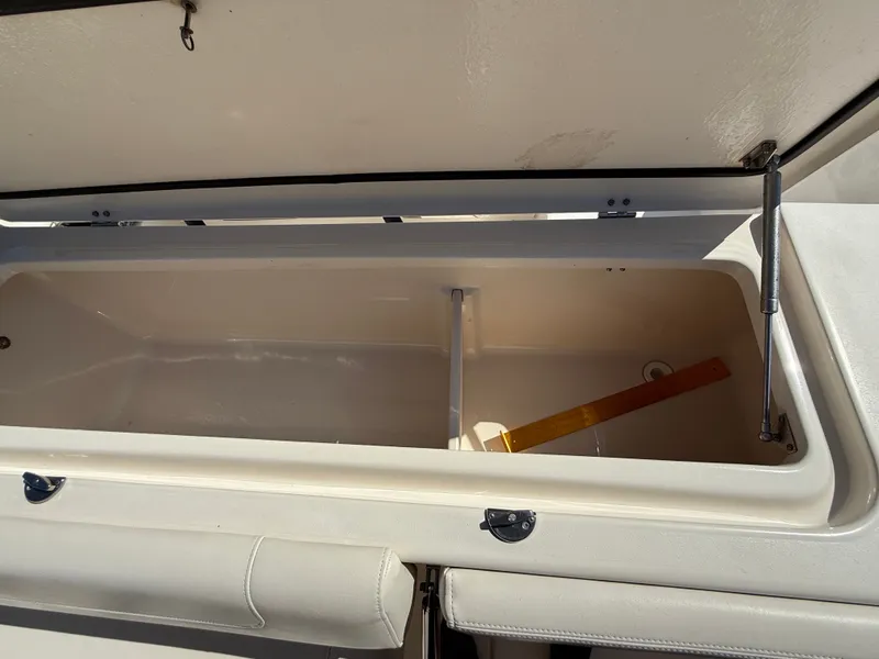Slide: The Image of An open storage compartment on a 2022 Grady-White Canyon 306 boat. - 41