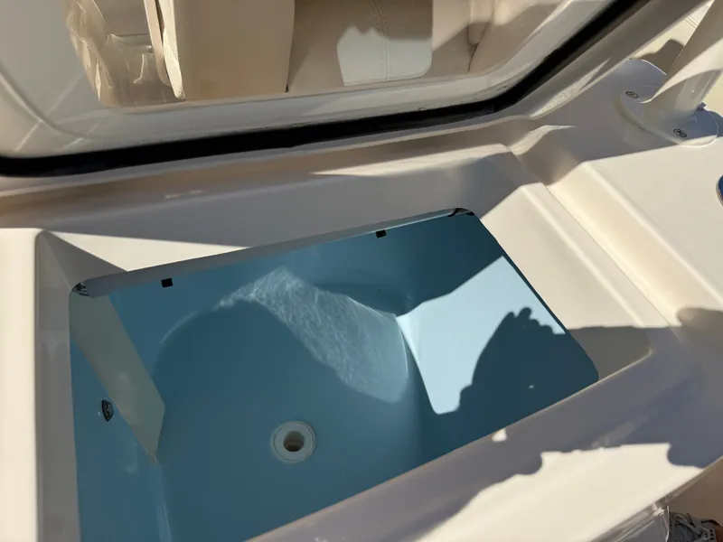 Slide: The Image of An open storage compartment on a 2022 Grady-White Canyon 306 boat. - 40