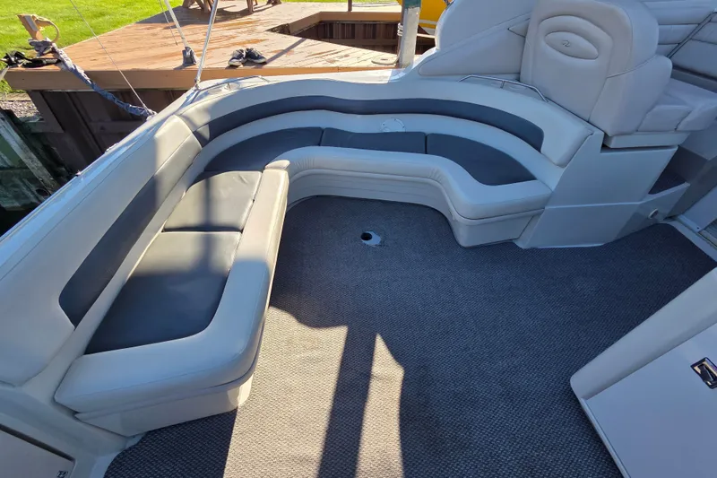 Slide: The Image of Luxurious seating area on a 1997 Regal Commodore 402 boat, featuring plush upholstery. - 15