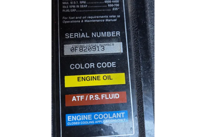 Slide: The Image of Label on a 1997 Regal Commodore 402 engine, showing serial number and fluid color codes. - 44