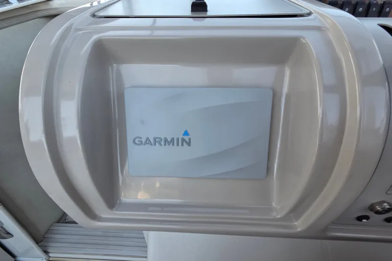 Slide: The Image of Garmin navigation system on 1997 Regal Commodore 402 boat dashboard. - 21