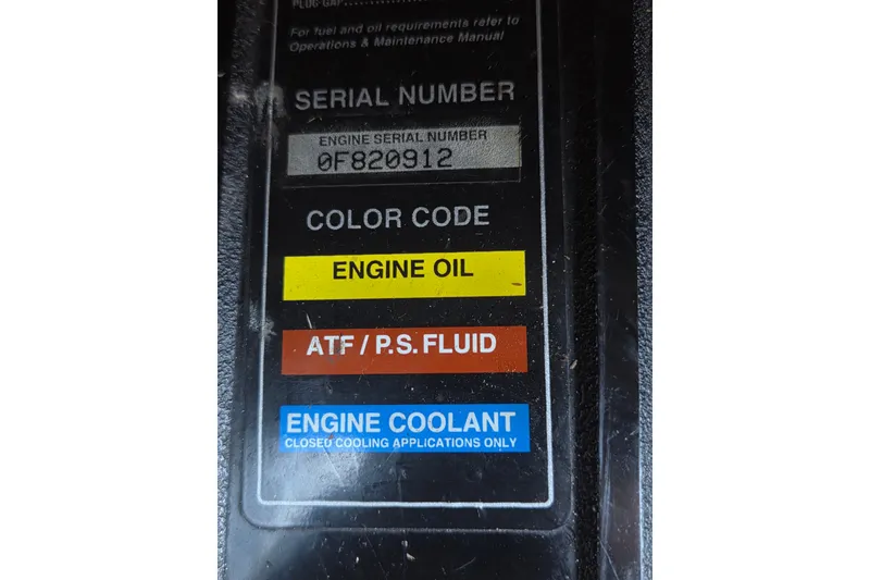 Slide: The Image of Label with engine serial number and fluid color codes for Regal Commodore 402, 1997. - 45