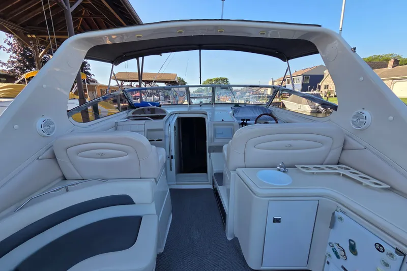 Slide: The Image of Interior view of a 1997 Regal Commodore 402 boat with seating and helm. - 11