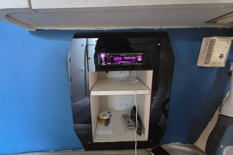 Slide: The Image of 1997 Regal Commodore 402 interior with stereo system and storage shelves. - 27