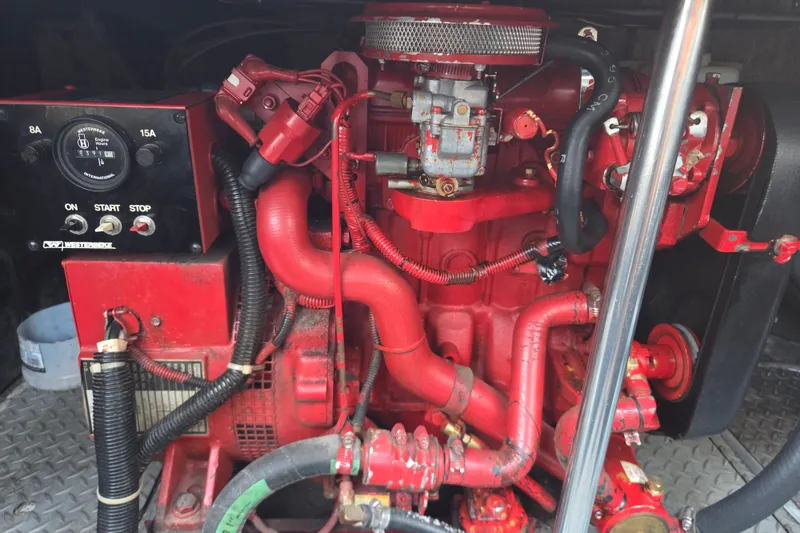 Slide: The Image of Red engine of a 1997 Regal Commodore 402 boat, showcasing intricate mechanical components. - 37