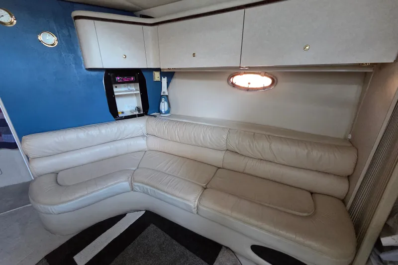 Slide: The Image of Luxurious interior of a 1997 Regal Commodore 402 yacht with cream leather seating. - 26