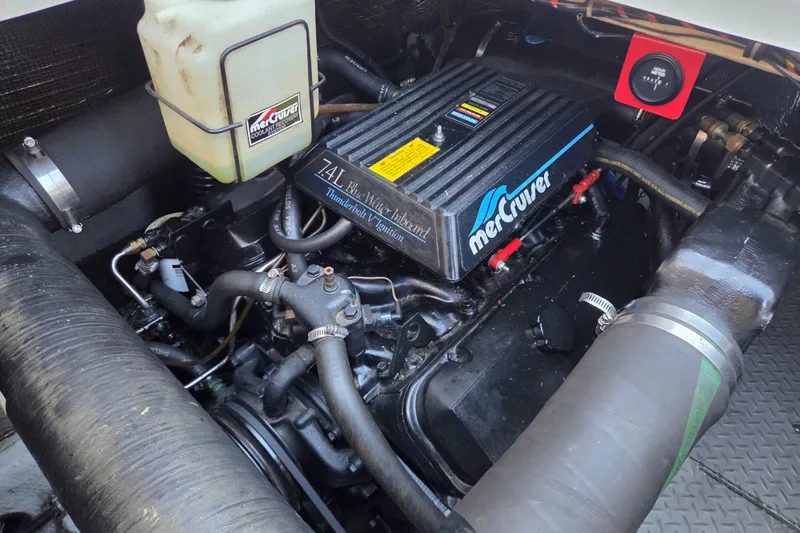 Slide: The Image of Engine compartment of a 1997 Regal Commodore 402 with MerCruiser 7.4L engine. - 42