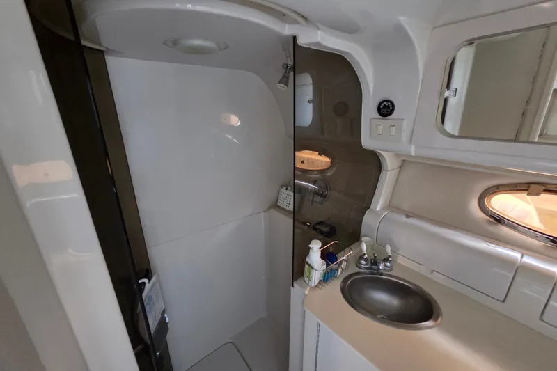 Slide: The Image of Bathroom interior of 1997 Regal Commodore 402 yacht, featuring sink and shower area. - 29