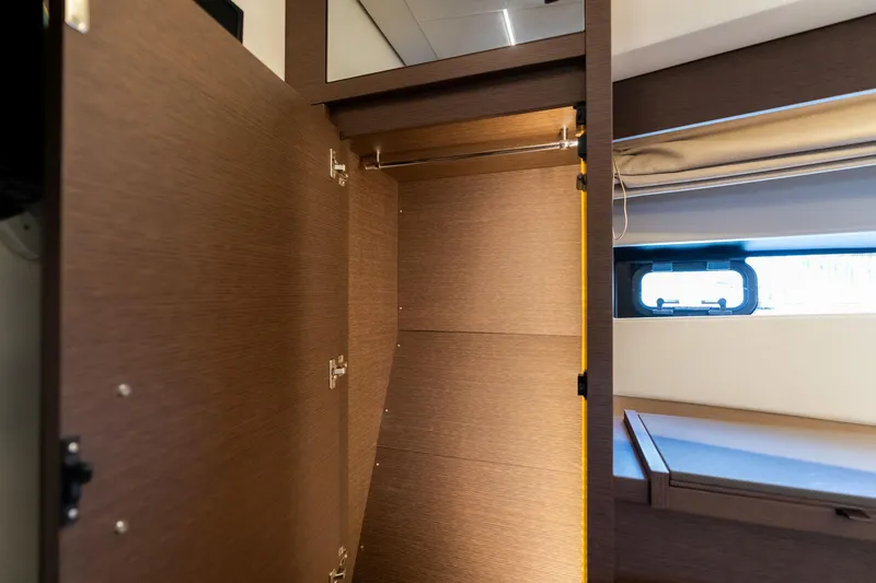 Slide: The Image of Empty wooden closet interior on a 2022 Prestige 520 yacht. - 43