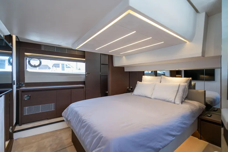 Slide: The Image of Luxurious bedroom interior of 2022 Prestige 520 yacht with modern lighting and elegant design. - 16