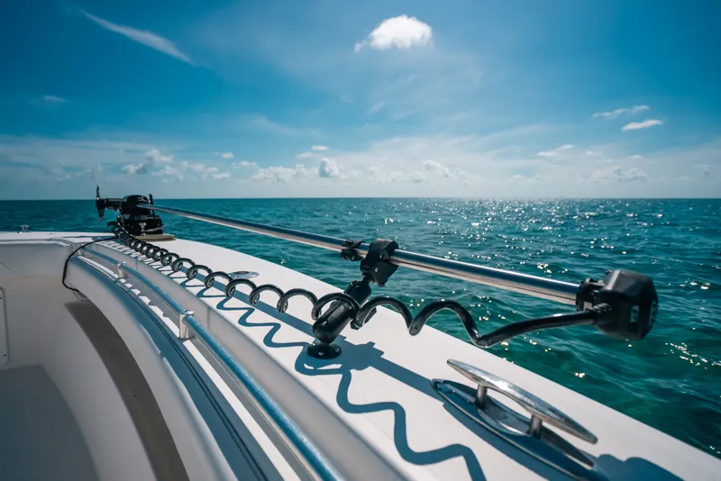 Slide: The Image of 2013 Invincible 42 Open Fisherman boat on open sea under clear blue sky. - 22